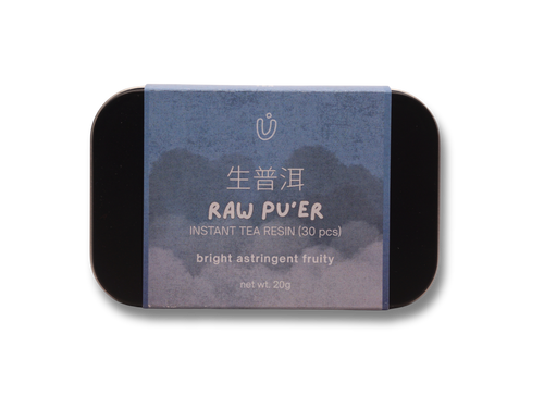 Tin of Raw Pu'er instant tea resin with blue label on a white background