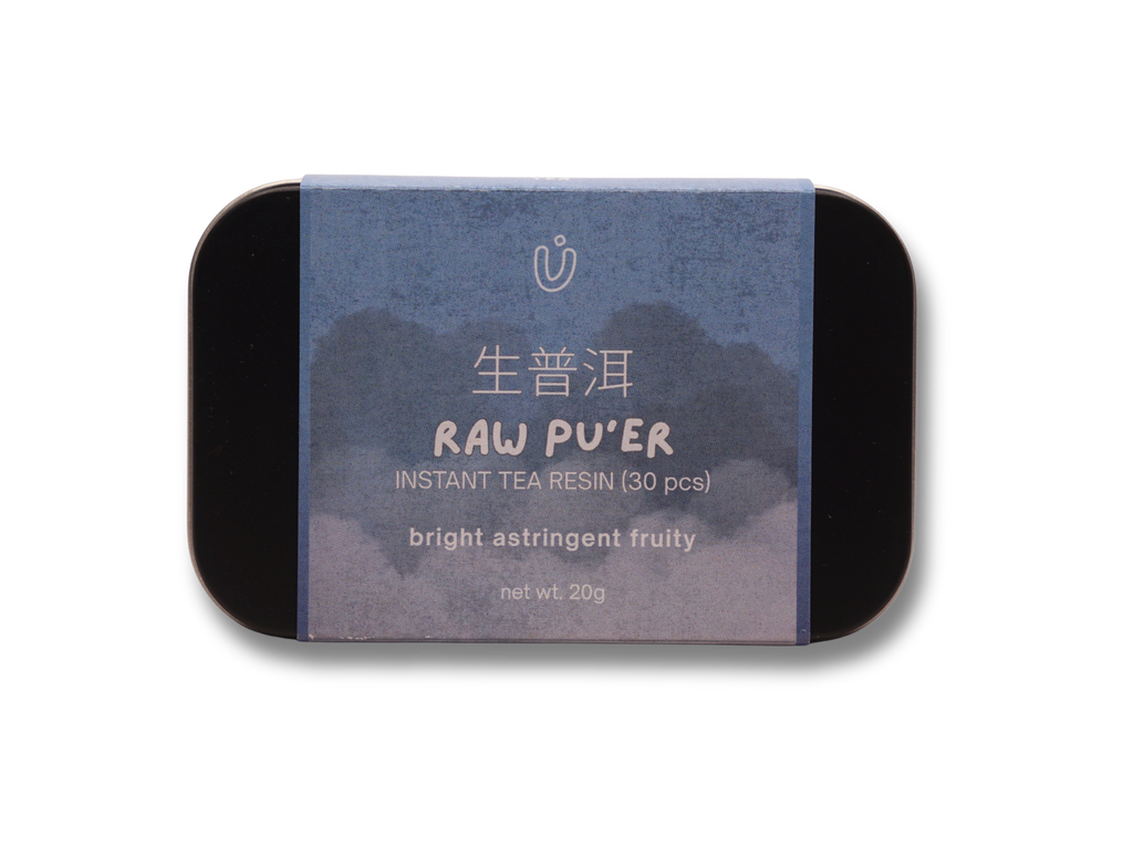 Tin of Raw Pu'er instant tea resin with blue label on a white background